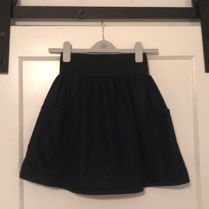 Dark blue mini skirt with pockets.